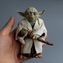 Figurine Jedi Yoda sabre laser